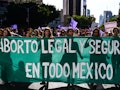 Women carry a banner reading "Legal and Safe Abortion Across Mexico" as they march during the commem...