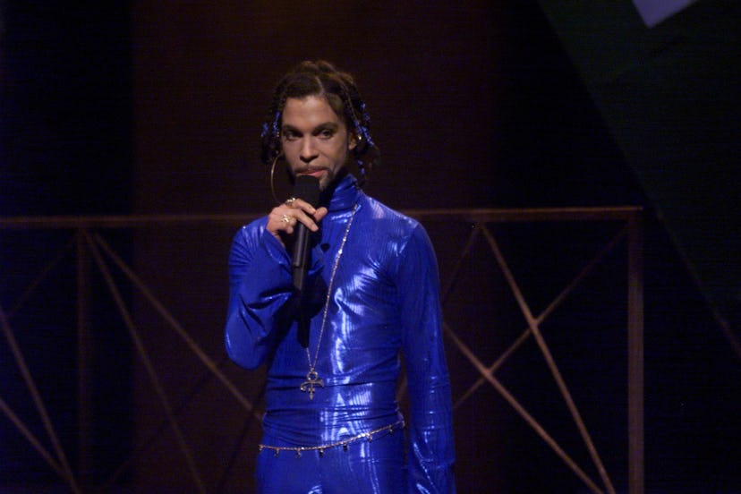 In 1999, Prince introduced TLC at the VMAs wearing an amazing blue jumpsuit, larger-than-life hoop e…