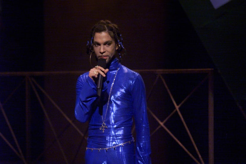 In 1999, Prince introduced TLC at the VMAs wearing an amazing blue jumpsuit, larger-than-life hoop e...