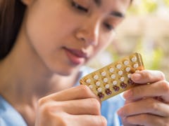 Woman hand holding a contraceptive panel prevent pregnancy