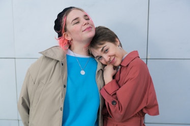 two friends embracing as they chat about october 15 being the best day for every zodiac sign