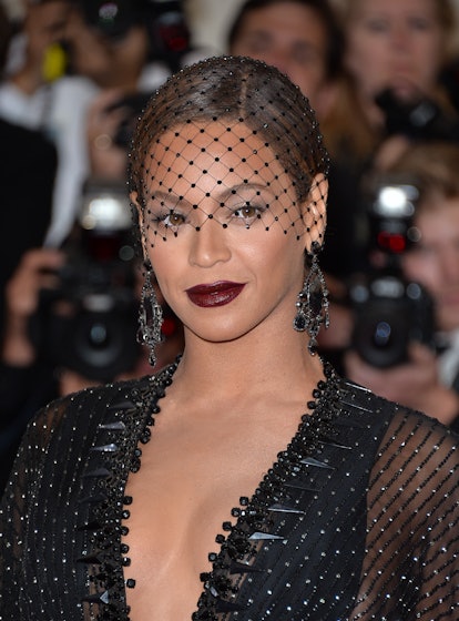 Beyonce dark oxblood lipstick and veil at Met Gala 2014