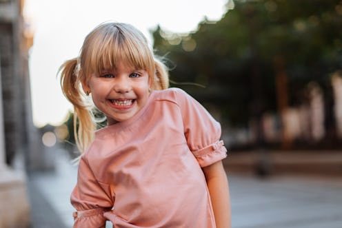 Portrait of a young blond girl making a funny face