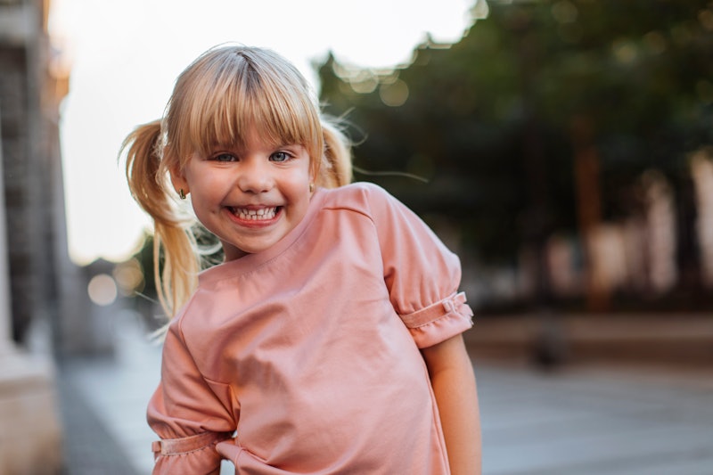 Portrait of a young blond girl making a funny face