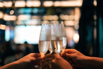 Business people toasting champagne flutes while celebrating Christmas