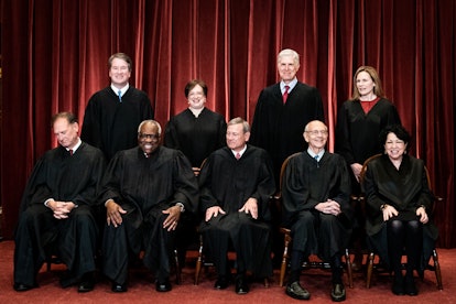 Members of the Supreme Court pose for a group photo at the Supreme Court.