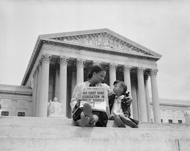 Nettie Hunt and her daughter Nickie sit on the steps of the U.S. Supreme Court. Nettie explains to h...