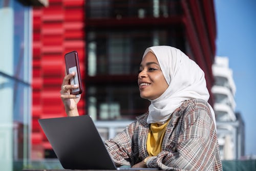 A woman in a white hijab likes a friend's Instagram story. Instagram is testing "private likes" on s...