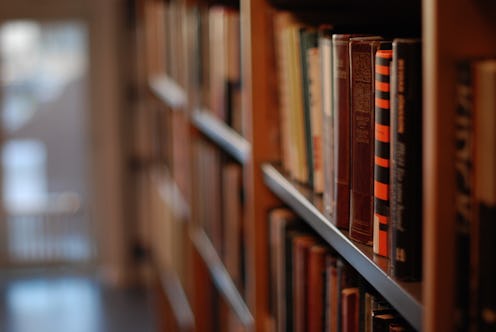 bookshelves with lots of books in a library or a bookstore