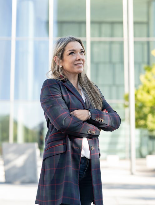 mature business woman crossing arms in the city