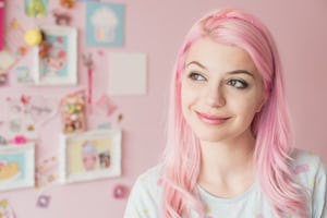 A woman shops for kawaii room decor to bring the kawaii pink aesthetic to her home.