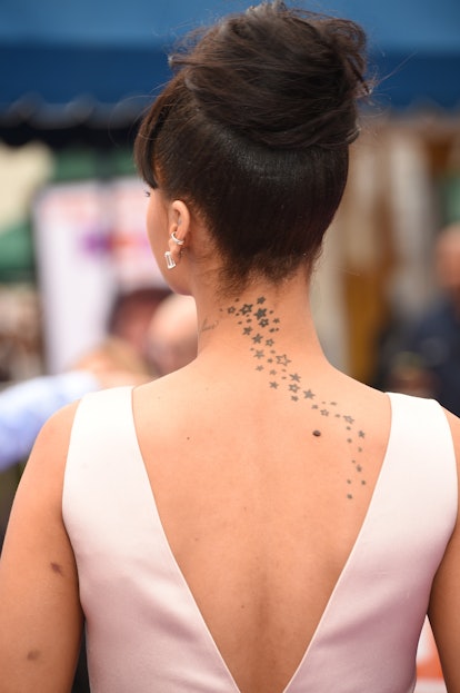 Rihanna has star tattoos on her back.