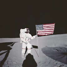 American astronaut Alan Bartlett Shepard Jr places an American flag on the moon. The United States' ...