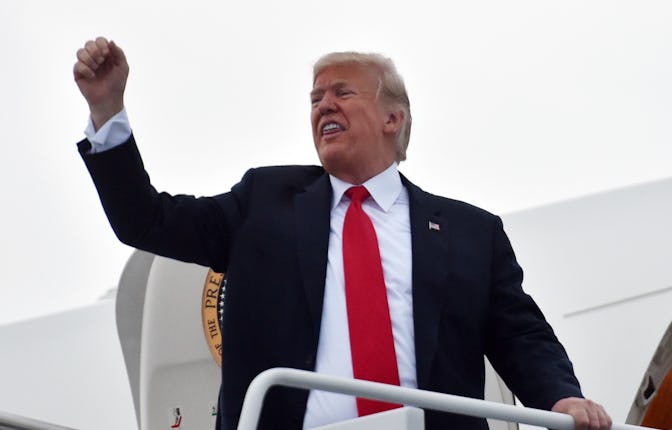 US President Donald Trump boards Air Force One at Middle Georgia Regional Airport on November 4, 201...