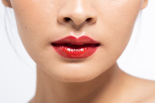 Close up bright red lipstick on beautiful lips