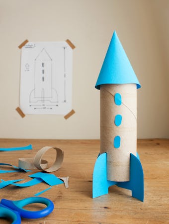 Make a rocket ship out of a toilet paper roll.