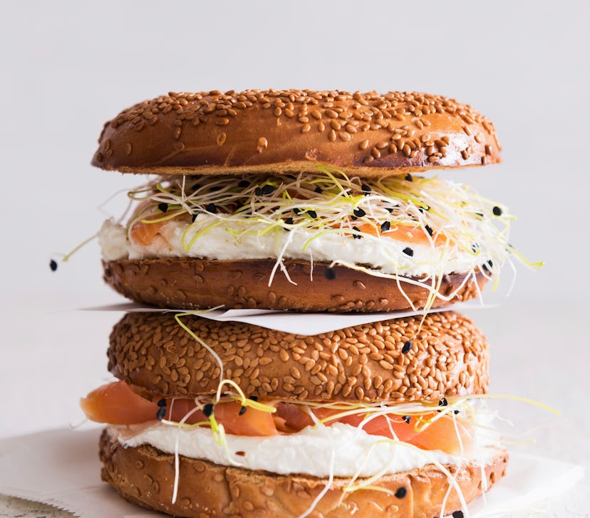 Sesame seed bagels with salmon, bean sprouts and cream cheese