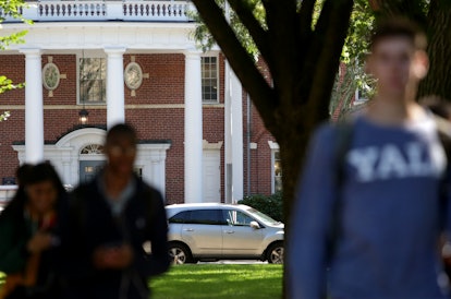 Students walk through the campus of Yale University. The university is among those accused of being ...
