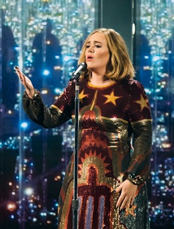 Adele wears custom Giambattista Valli gown.