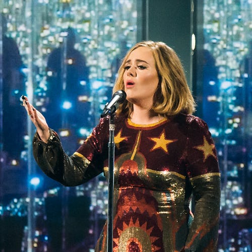 Adele wears custom Giambattista Valli gown.