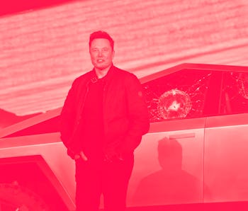 Tesla co-founder and CEO Elon Musk stands in front of the shattered windows of the newly unveiled al...