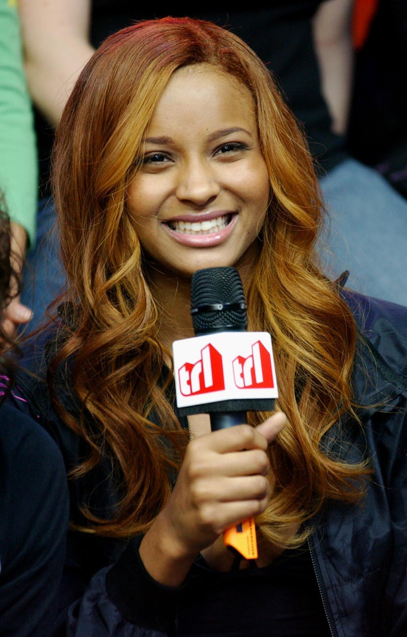  Ciara with warm brown hair with blonde highlights