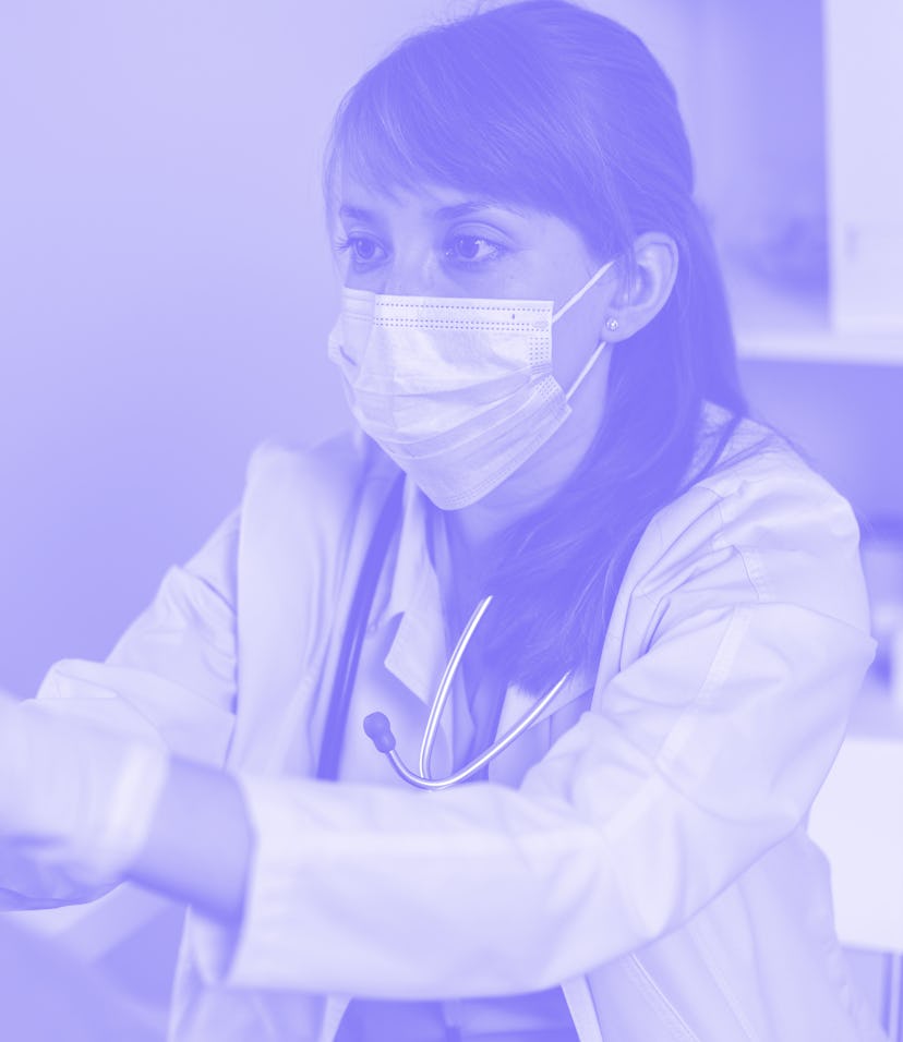 Female doctor in protective face mask checking up faceless male patient throat. Examing glands at cl...