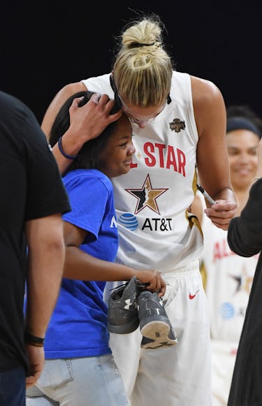 LAS VEGAS, NEVADA - JULY 27: Elena Delle Donne #11 of Team Delle Donne signs a pair of...