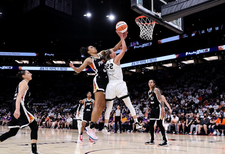 PHOENIX, ARIZONA - OCTOBER 10: Brianna Turner #21 of the Phoenix Mercury blocks a shot by Courtney V...