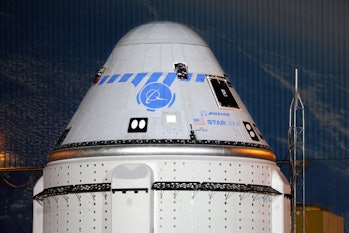 A close-up view of the CST-100 Starliner spacecraft while rolling out from Boeings Commercial Cargo ...