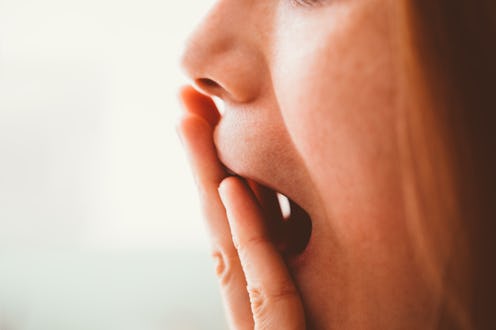 Cropped shot of a woman covering her mouth with her hand -
Worried, emotional stress, not speaking,...