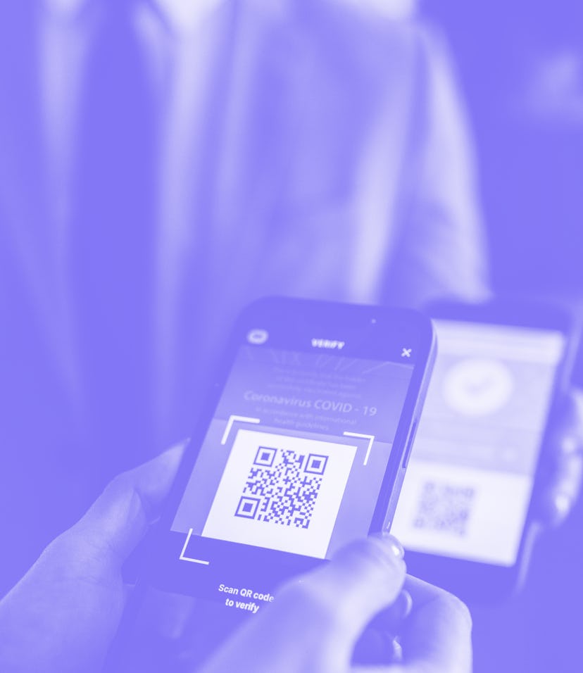 Business people waiting in line to show their covid-19 vaccination certificate before entrance in th...