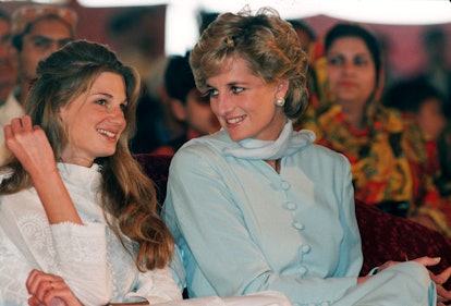 Diana, Princess of Wales, wearing a pale blue shalwar kameez, speaks to Jemima Khan during a visit t...