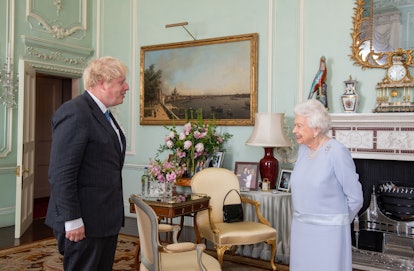 Queen Elizabeth II greets Prime Minister Boris Johnson during the first in-person weekly audience wi...