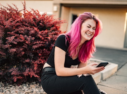 A woman with pink hair laughs at what is Blorbo memes from Tumblr that are trolling fandoms. 