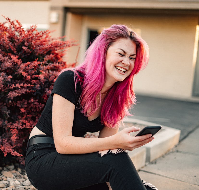 A woman with pink hair laughs at what is Blorbo memes from Tumblr that are trolling fandoms.