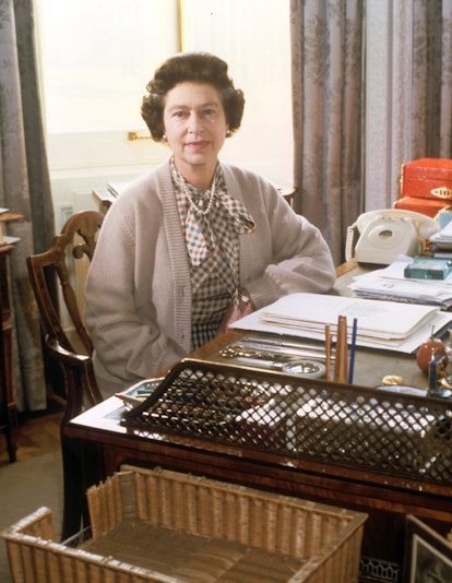 Queen Elizabeth II, at her desk in the study of Sandringham House, her Norfolk home, where she marke...