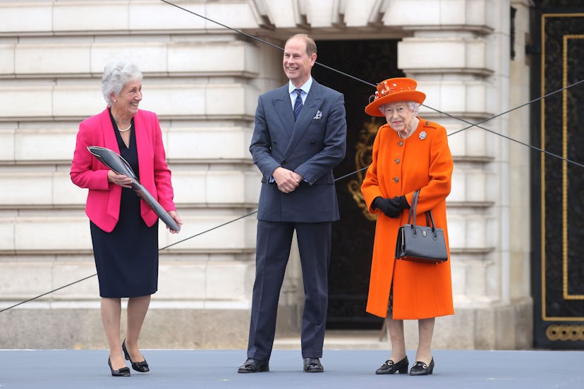Queen Elizabeth II, Prince Edward and Dame Louise Martin, President of the Commonwealth Games at the...