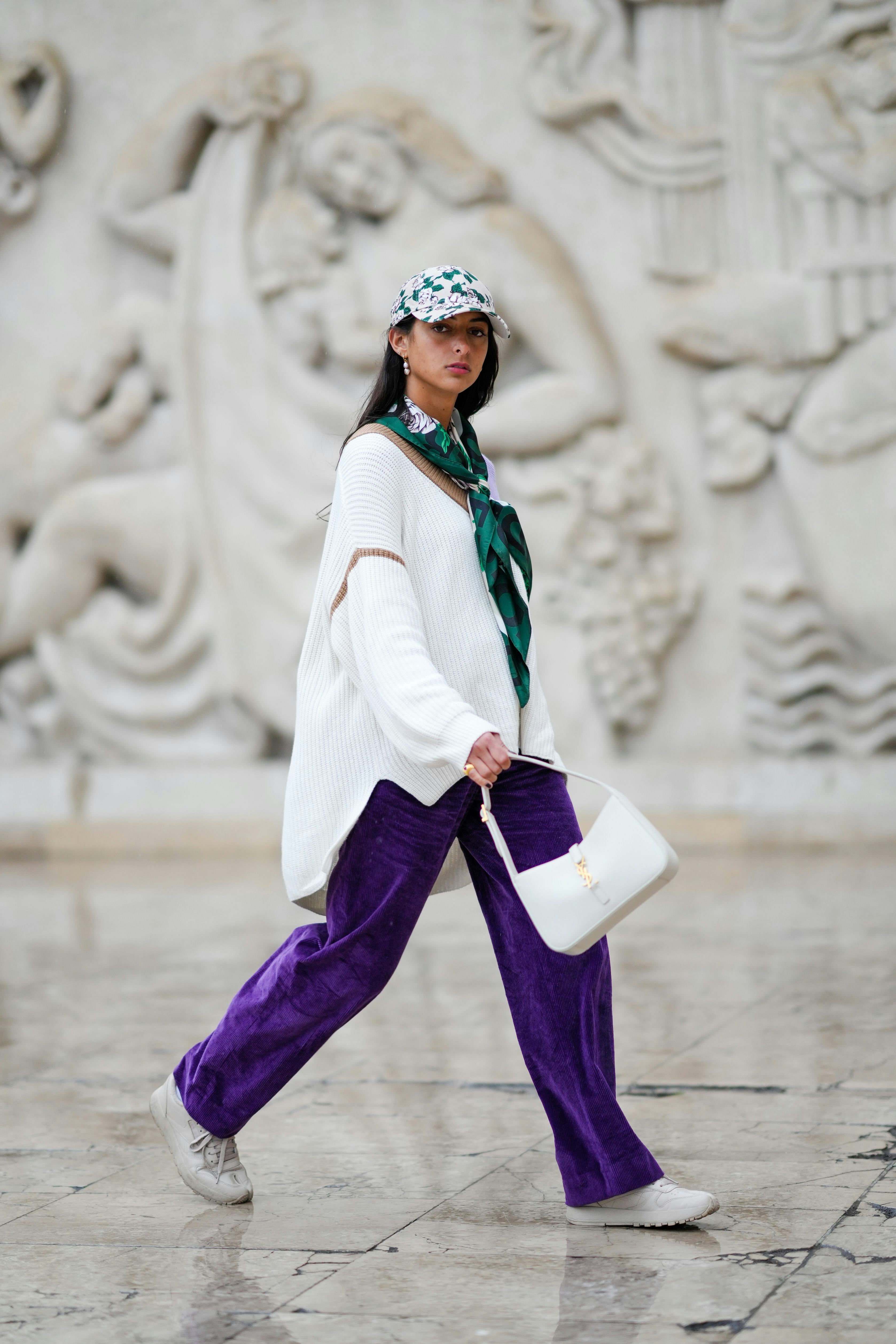A guest wears an oversized sweater in Paris, France. 