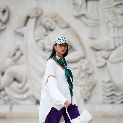 A guest wears an oversized sweater in Paris, France. 