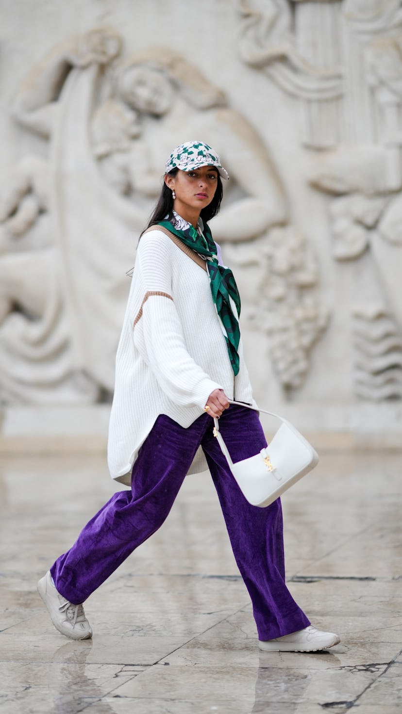A guest wears an oversized sweater in Paris, France.