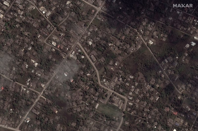 TONGA HOMES AND BUILDINGS -- JANUARY 18, 2022:  Maxar satellite imagery of ash covered homes and bui...
