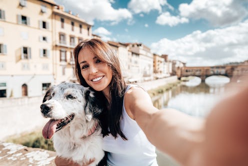 woman take a selfie with the dog in florence
