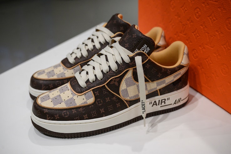 A pair of Louis Vuitton-Nike sneakers is displayed at Sotheby's in New York on January 19, 2022. - T...