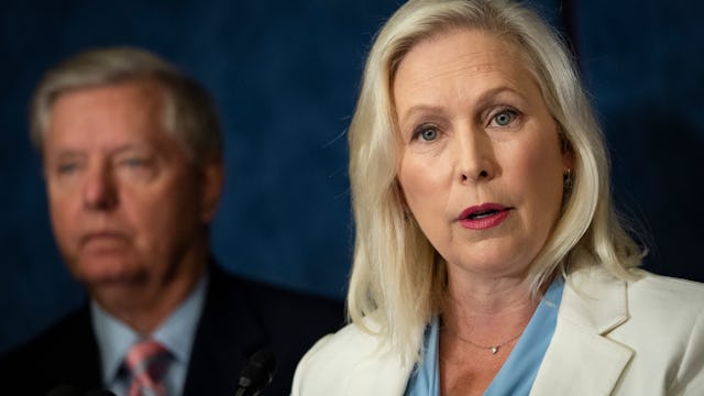 WASHINGTON, DC - JULY 14: (L-R) Sen. Lindsey Graham (R-SC) and Sen. Kirsten Gillibrand (D-NY) hold a...