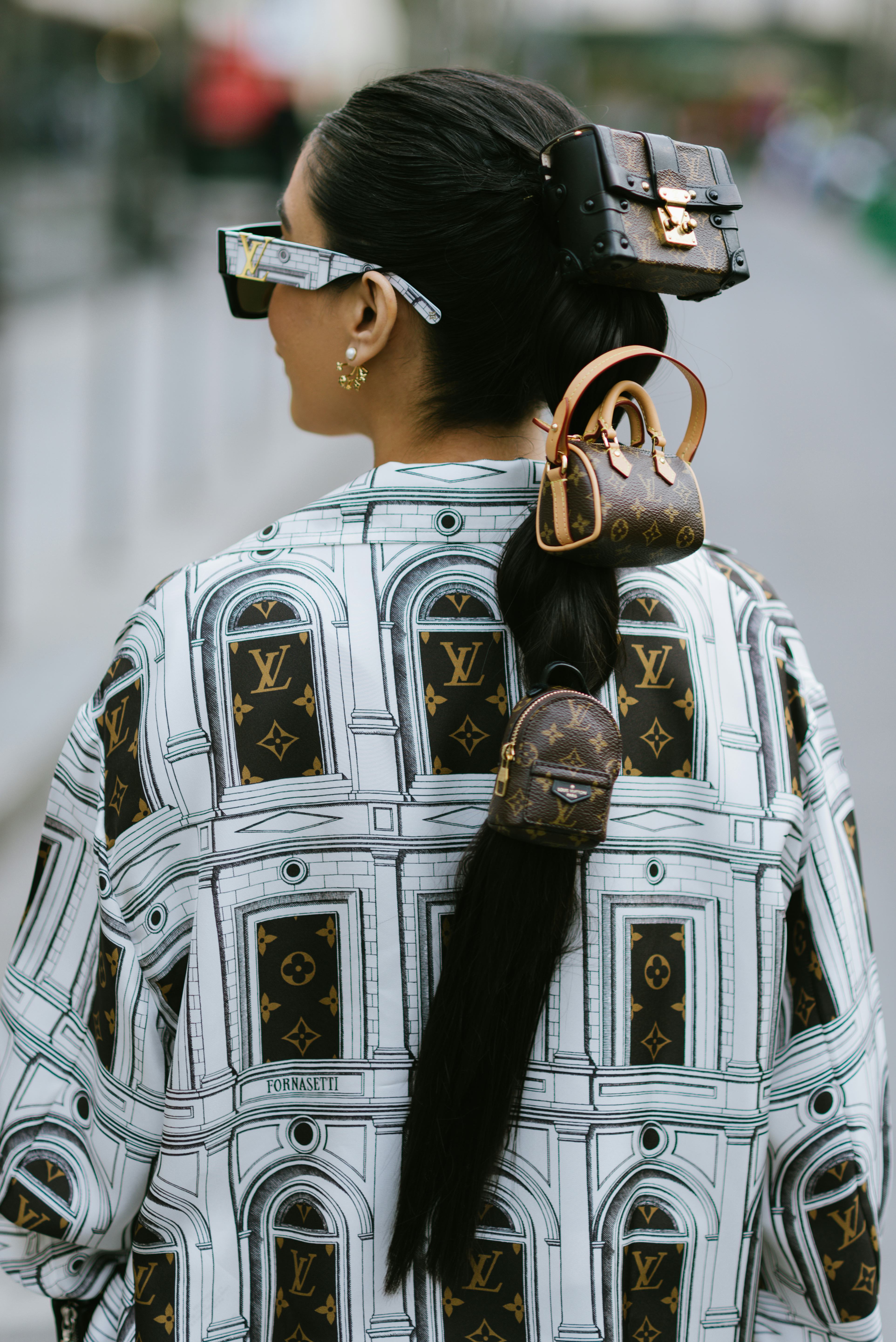 PARIS, FRANCE - JANUARY 20: A guest poses wearing Louis Vuitton after the Louis Vuitton show at the ...