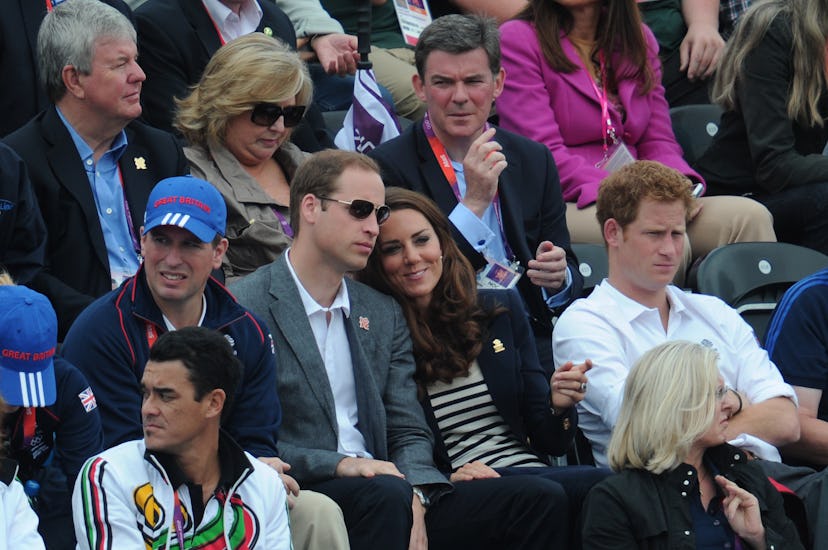 Kate Middleton rests her head on her husband's shoulder.