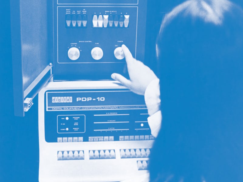 A woman adjusting an Applied Logic Corporation (AL/COM) time sharing AL-10 computer system, which co...