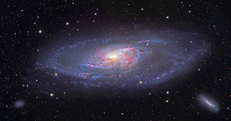 M106, spiral galaxy in Canes Venatici. This view captures the entire galaxy, detailing the glowing s...