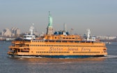 New York, USA – Feb 27th, 2017: The Staten Island Ferry crossing the bay early in the day with the S...